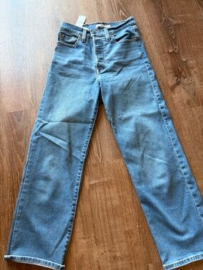 Levi's High Rise Wide Leg Jeans in Medium Blue 25 in inseam